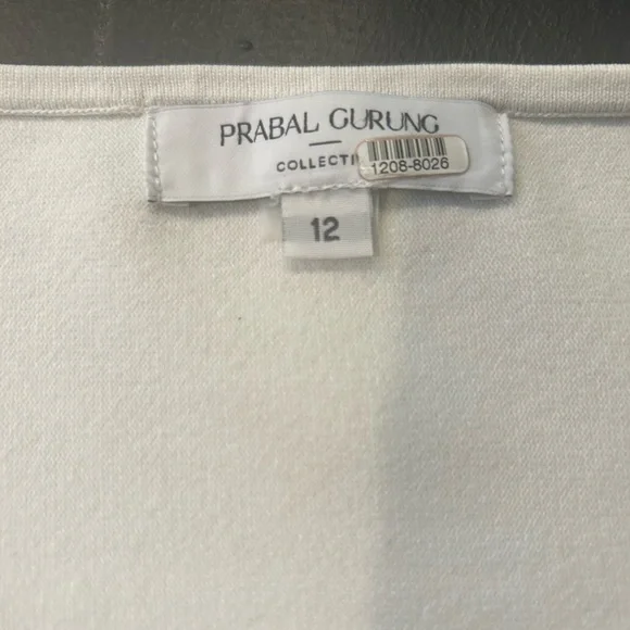 Prabal Gurung Peplum White with Black Stitching Asymmetrical Top. - Picture 5 of 7